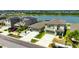 Beautiful aerial view of two story home with a two car garage near a calm lake at 872 Olive Conch St, Ruskin, FL 33570