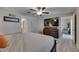 Comfortable bedroom featuring modern design, fan, and closet at 872 Olive Conch St, Ruskin, FL 33570