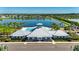 Photo of a blue and gray recreation center with pool and clubhouse overlooking a pristine lake at 872 Olive Conch St, Ruskin, FL 33570
