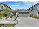 Charming single-story home with a two-car garage and well-manicured landscaping at 872 Olive Conch St, Ruskin, FL 33570