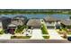 Beautiful exterior view of houses near lake with landscaping, driveways and attached garages at 872 Olive Conch St, Ruskin, FL 33570