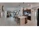 Open-concept kitchen featuring a large island with seating and pendant lighting at 872 Olive Conch St, Ruskin, FL 33570