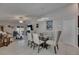 Comfortable living and dining area with tile floors and sliding glass doors to the patio at 872 Olive Conch St, Ruskin, FL 33570
