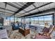 Covered patio featuring outdoor furniture, relaxing views of the lake, and a ceiling at 872 Olive Conch St, Ruskin, FL 33570