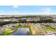 Aerial view of a neighborhood highlighting a home with lake views at 8916 Windlass Cv, Parrish, FL 34219