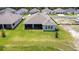 Aerial view of the backyard, covered patio, and landscaping at 8916 Windlass Cv, Parrish, FL 34219