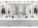 Modern bathroom with double sinks, white cabinets, and a clear view of the walk-in shower at 8916 Windlass Cv, Parrish, FL 34219