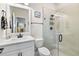 Modern bathroom featuring a glass-enclosed shower and sleek fixtures at 8916 Windlass Cv, Parrish, FL 34219