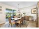 Inviting dining area with elegant furnishings, natural lighting, and scenic views of the outdoor space at 8916 Windlass Cv, Parrish, FL 34219