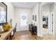 Bright foyer with hardwood floors, decorated with stylish furniture and artwork, creating an inviting entrance at 8916 Windlass Cv, Parrish, FL 34219