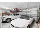 Two car garage with overhead storage racks and plenty of room for storage at 8916 Windlass Cv, Parrish, FL 34219