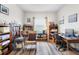 Inviting home office with a rocking chair, bookshelves, and a well-lit desk area for comfortable work at 8916 Windlass Cv, Parrish, FL 34219