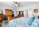 Spacious main bedroom with ceiling fan, closet, and ensuite bathroom access at 8916 Windlass Cv, Parrish, FL 34219