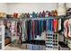 Organized walk-in closet with shelving and hanging space for clothes, shoes, and accessories at 8916 Windlass Cv, Parrish, FL 34219