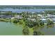 Beautiful lakefront home with lush tropical landscaping and mature trees at 8927 Key West Island Way, Riverview, FL 33578