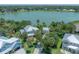 A charming lakefront home with lush landscaping and mature trees at 8927 Key West Island Way, Riverview, FL 33578