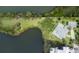 Expansive waterfront lot with lush greenery and mature trees surrounding the property at 8927 Key West Island Way, Riverview, FL 33578
