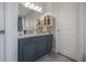 Clean bathroom design with marble countertop, cabinet storage, and tile floors at 8927 Key West Island Way, Riverview, FL 33578