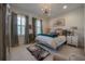Serene bedroom featuring soft neutral tones, plush bedding, and natural light, creating a relaxing retreat at 8927 Key West Island Way, Riverview, FL 33578