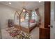 Charming bedroom featuring a decorative canopy bed, soft lighting, and a cozy rug at 8927 Key West Island Way, Riverview, FL 33578