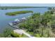 Beautiful aerial view of a private boat dock with multiple boat slips on the water at 8927 Key West Island Way, Riverview, FL 33578