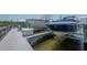 Private boat lift with two boats on the water at 8927 Key West Island Way, Riverview, FL 33578