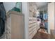 Custom closet featuring lots of shelving and drawers for maximum storage and organization at 8927 Key West Island Way, Riverview, FL 33578