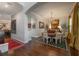 Elegant dining room featuring hardwood floors, stylish decor, arched doorways, and seamless transition to other rooms at 8927 Key West Island Way, Riverview, FL 33578