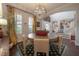 Charming dining area with hardwood floors, plantation shutters and views to staircase and front entry at 8927 Key West Island Way, Riverview, FL 33578