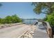 Home features a private boat ramp and dock for easy lake access and waterfront enjoyment at 8927 Key West Island Way, Riverview, FL 33578