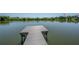 Dock on lake, offering serene access to the water at 8927 Key West Island Way, Riverview, FL 33578