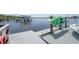 This waterfront property features a private dock with a boat lift and kayak storage at 8927 Key West Island Way, Riverview, FL 33578