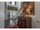 Inviting foyer with hardwood floors, staircase, and a striking art piece at 8927 Key West Island Way, Riverview, FL 33578