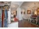 Inviting foyer with hardwood floors, arched doorways, stylish lighting, and elegant decor at 8927 Key West Island Way, Riverview, FL 33578
