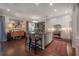 Open-concept kitchen with bar seating, stainless steel appliances, and stylish decor at 8927 Key West Island Way, Riverview, FL 33578
