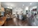 Spacious kitchen with white cabinets, central island, stainless steel appliances, and open layout at 8927 Key West Island Way, Riverview, FL 33578