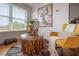 Cozy living room area with natural light, stylish decor, and modern accent chair at 8927 Key West Island Way, Riverview, FL 33578