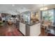 Open concept living space featuring a large island with seating and views to the living room at 8927 Key West Island Way, Riverview, FL 33578