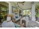Charming outdoor living area with comfortable seating and a picturesque view of the play area at 8927 Key West Island Way, Riverview, FL 33578