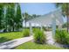Outdoor pergola set in a serene grassy area, offers a perfect spot for relaxation by the water at 8927 Key West Island Way, Riverview, FL 33578