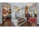 Elegant staircase leading to the second floor, with hardwood steps and white railings at 8927 Key West Island Way, Riverview, FL 33578