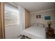 Cozy bedroom features a large window and classic style decor and furniture at 9025 1St Ne St, St Petersburg, FL 33702