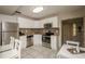 Charming kitchen boasts stainless appliances, white cabinets and a dining area at 9025 1St Ne St, St Petersburg, FL 33702