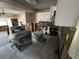 Kitchen area under renovation with modern white cabinets and stainless steel appliances at 9025 1St Ne St, St Petersburg, FL 33702