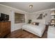 The main bedroom is spacious with wood flooring, a large window and a bed at 9025 1St Ne St, St Petersburg, FL 33702
