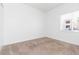 A clean and well-lit bedroom with neutral carpet and a bright window at 9524 Newdale Way # 101, Riverview, FL 33578
