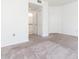 Bedroom features neutral carpet and an ensuite bathroom at 9524 Newdale Way # 101, Riverview, FL 33578