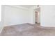 Bedroom features neutral carpet, bright lighting, and closet at 9524 Newdale Way # 101, Riverview, FL 33578