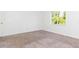 Bright bedroom with neutral carpet and window at 9524 Newdale Way # 101, Riverview, FL 33578