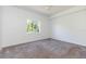 Well-lit bedroom with neutral carpet and a bright window at 9524 Newdale Way # 101, Riverview, FL 33578